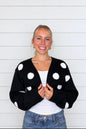 CASSIE’S BLACK POLKA DOT SWEATER