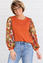 CHERYL’S SOLID TOP WITH FLORAL SLEEVES
